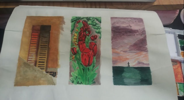 watercolor supplies in sight, red tulips missing final touches